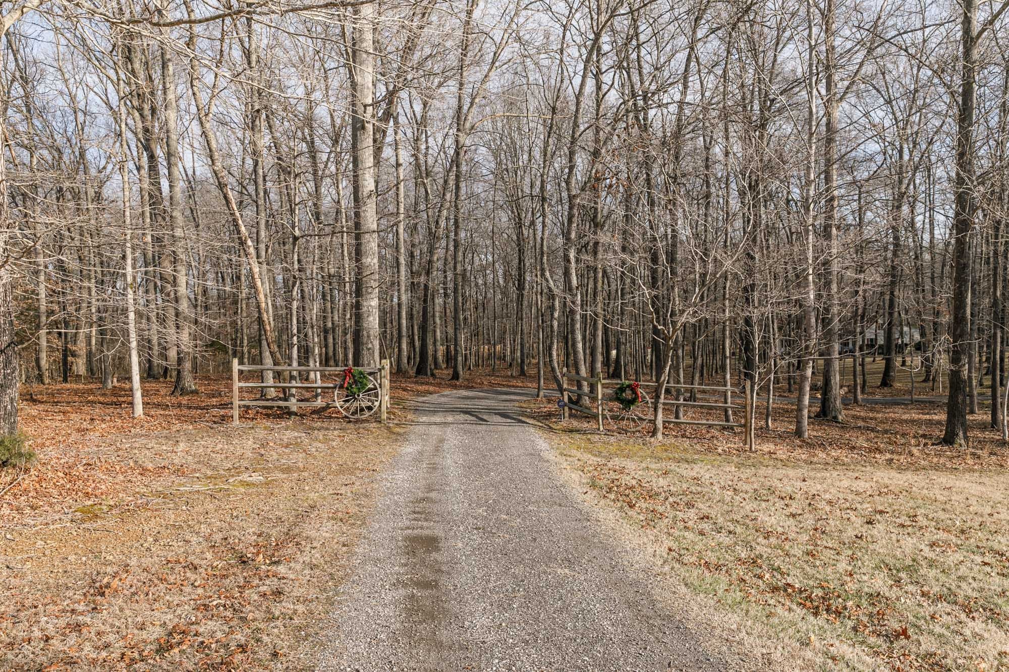 7126 Elrod Road Fairview, TN 37062 - Photo 3 of 36 a backyard of a house with large trees
