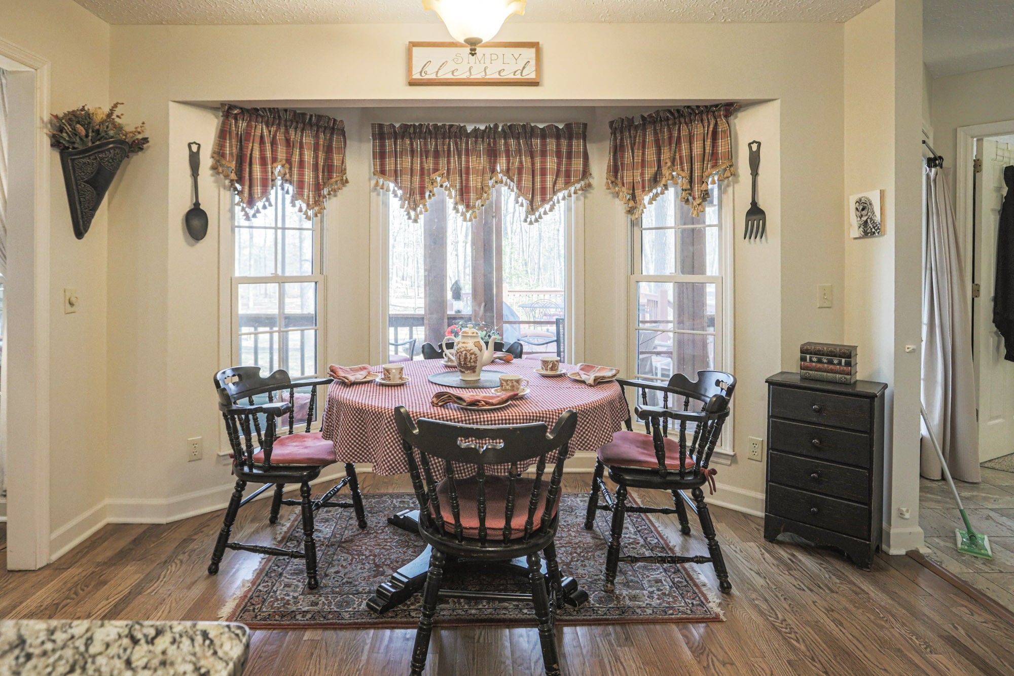 7126 Elrod Road Fairview, TN 37062 - Photo 31 of 36 a view of a dining room with furniture window and wooden floor