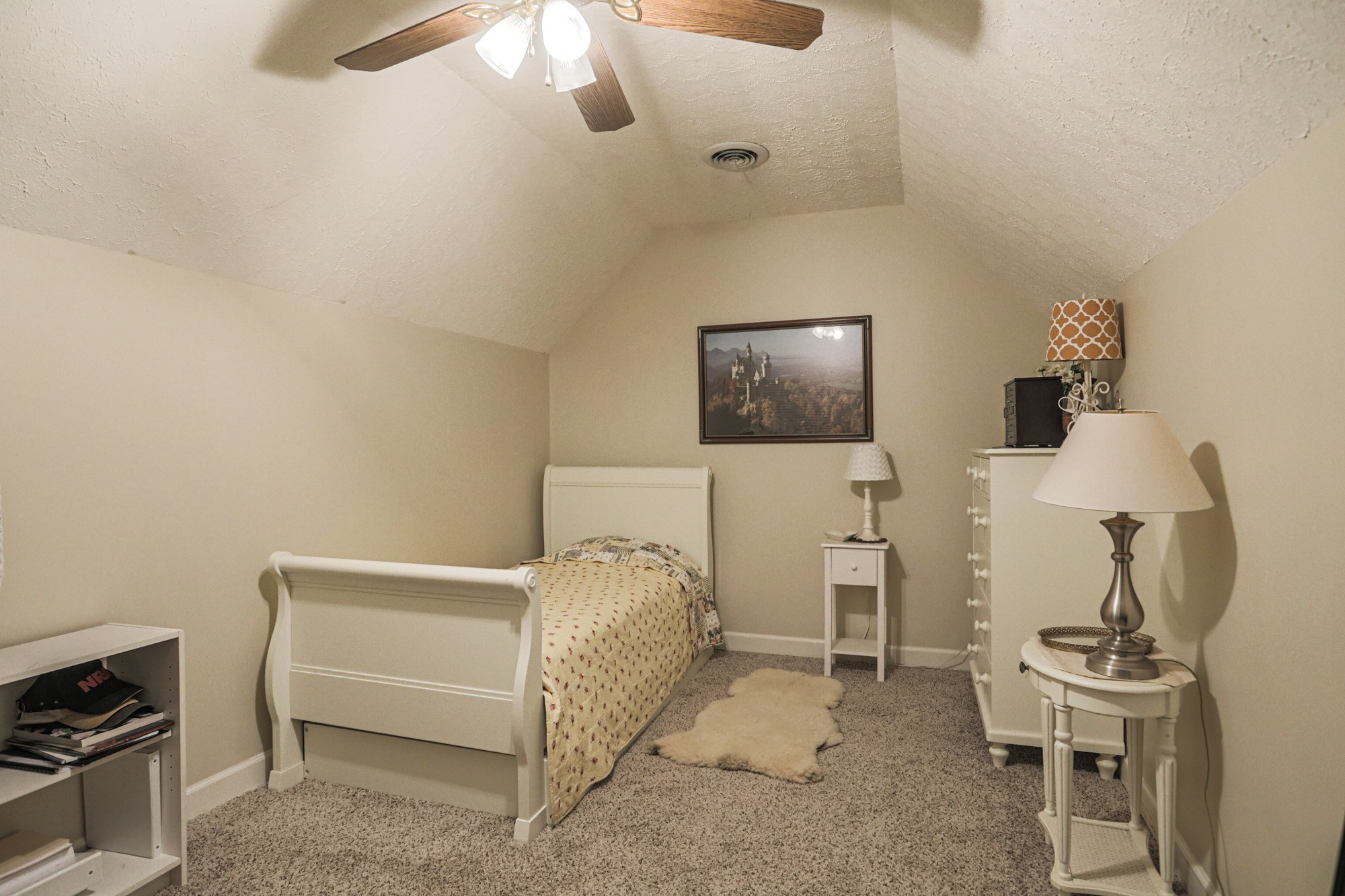 7126 Elrod Road Fairview, TN 37062 - Photo 34 of 36 a bedroom with furniture and a flat screen tv