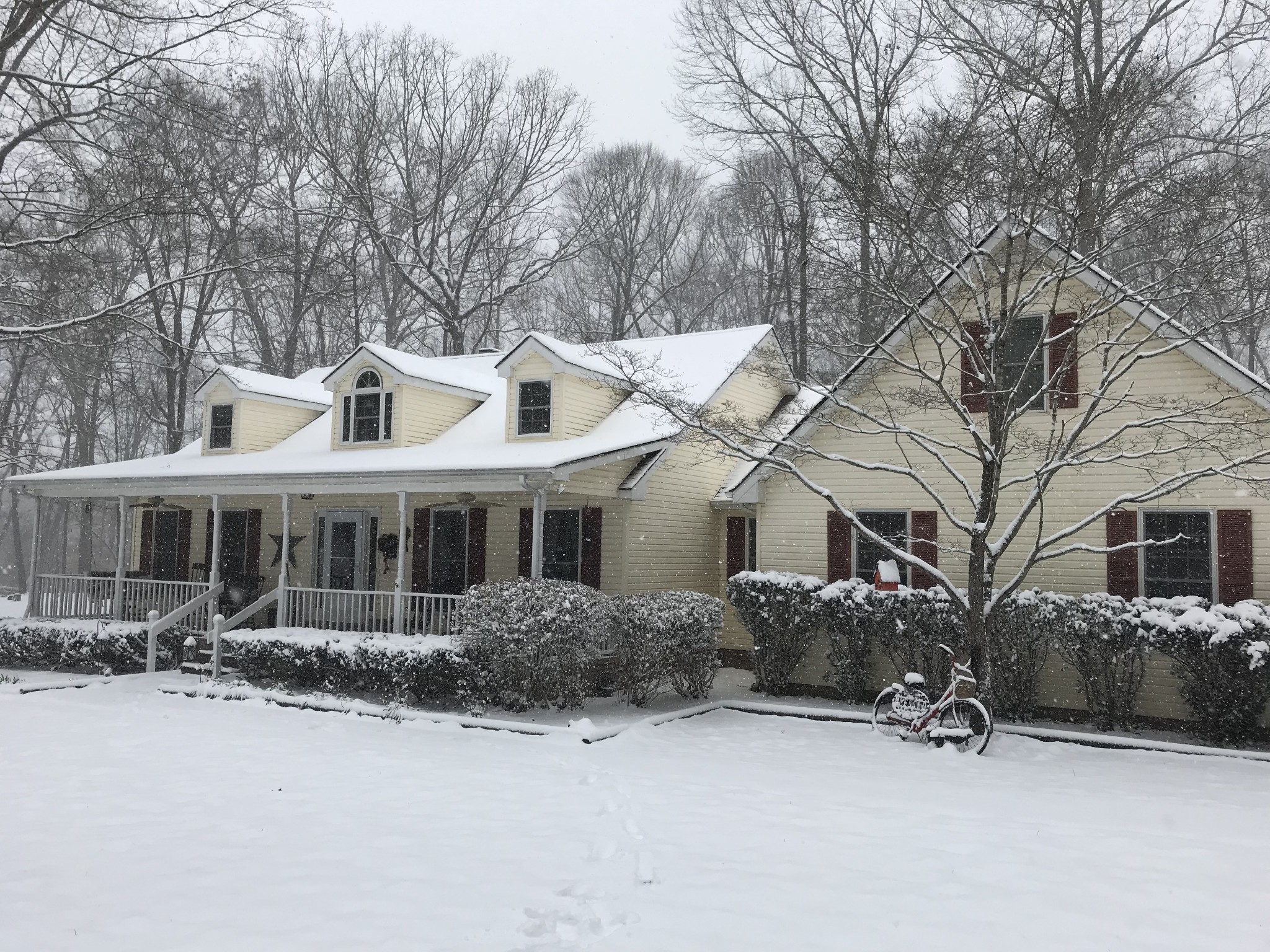 7126 Elrod Road Fairview, TN 37062 - Photo 36 of 36 a view of a house with a yard covered in snow