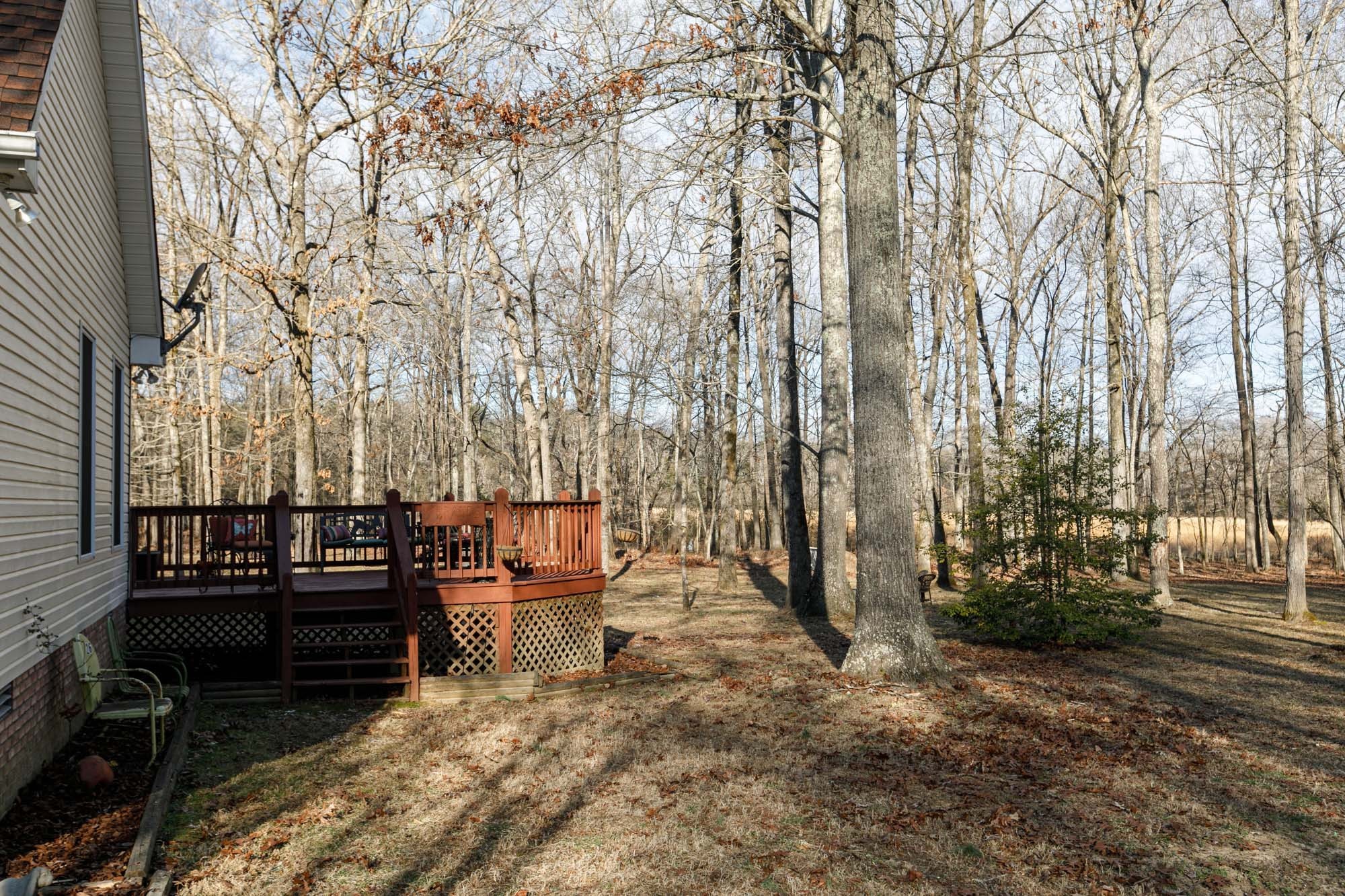 7126 Elrod Road Fairview, TN 37062 - Photo 9 of 36 a backyard of a house with barbeque oven and outdoor seating