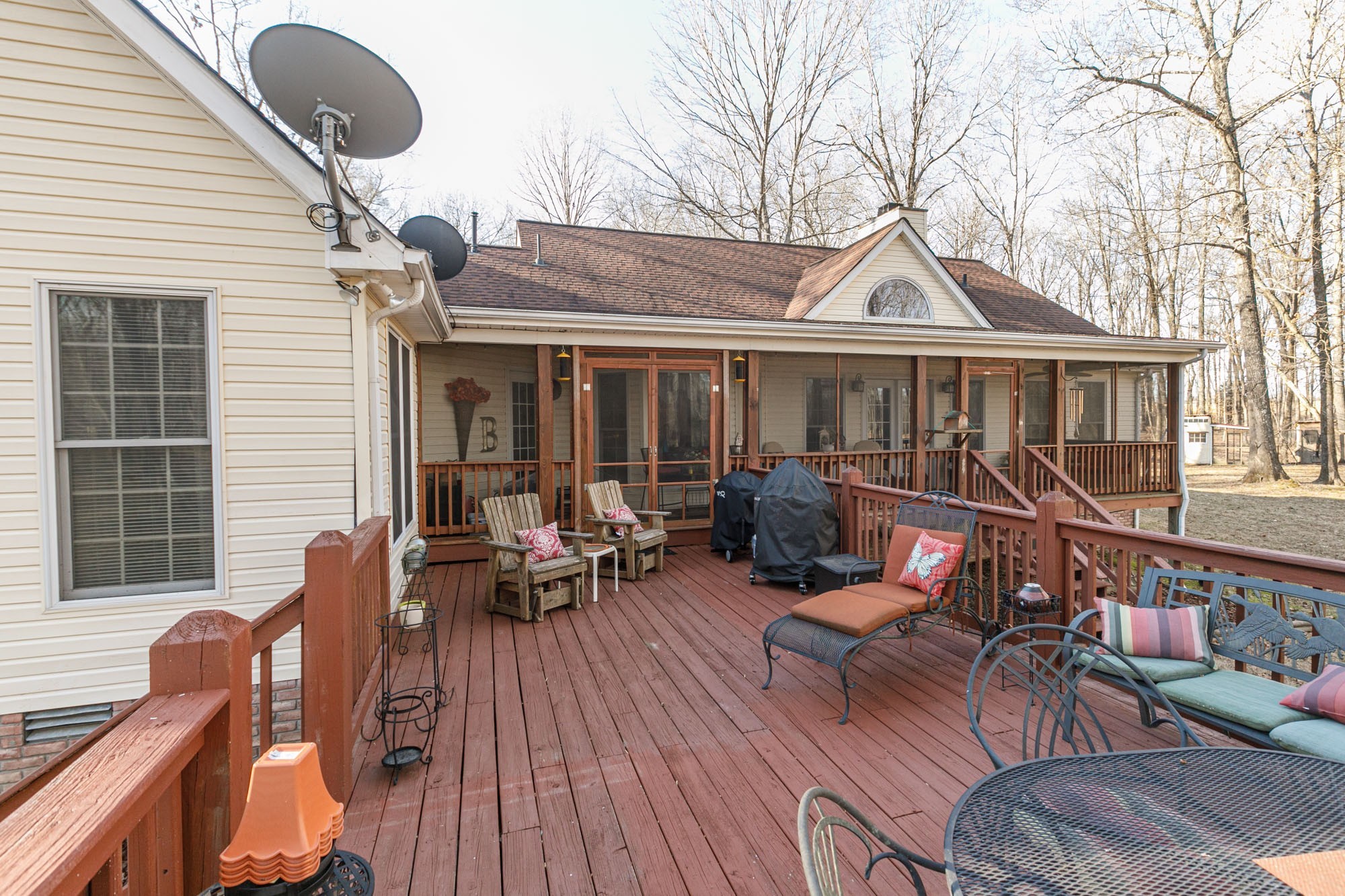 7126 Elrod Road Fairview, TN 37062 - Photo 10 of 36 a view of a house with wooden deck and furniture