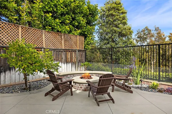 a view of a patio with a table and chairs