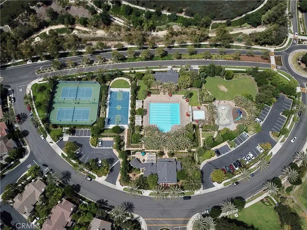 an aerial view of residential houses with outdoor space