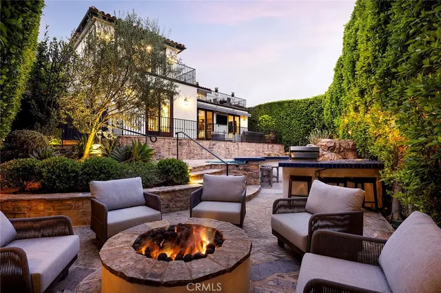 a outdoor living space with furniture and a fireplace