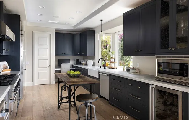 a view of a roof deck with couches and sky view