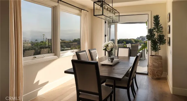 a bathroom with a granite countertop sink a toilet and a large mirror