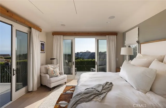 a en suite bathroom with a double vanity sink a large mirror and a shower