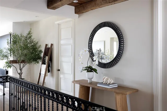 a living room with furniture and floor to ceiling window