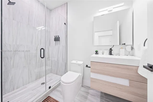 a spacious bedroom with a bed a couch and a window