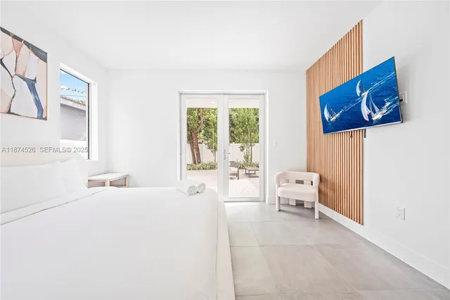 a bedroom with a bed and a couch