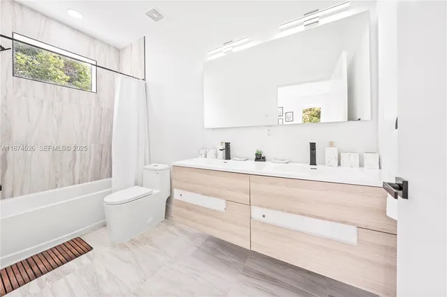 an aerial view of residential houses with city view