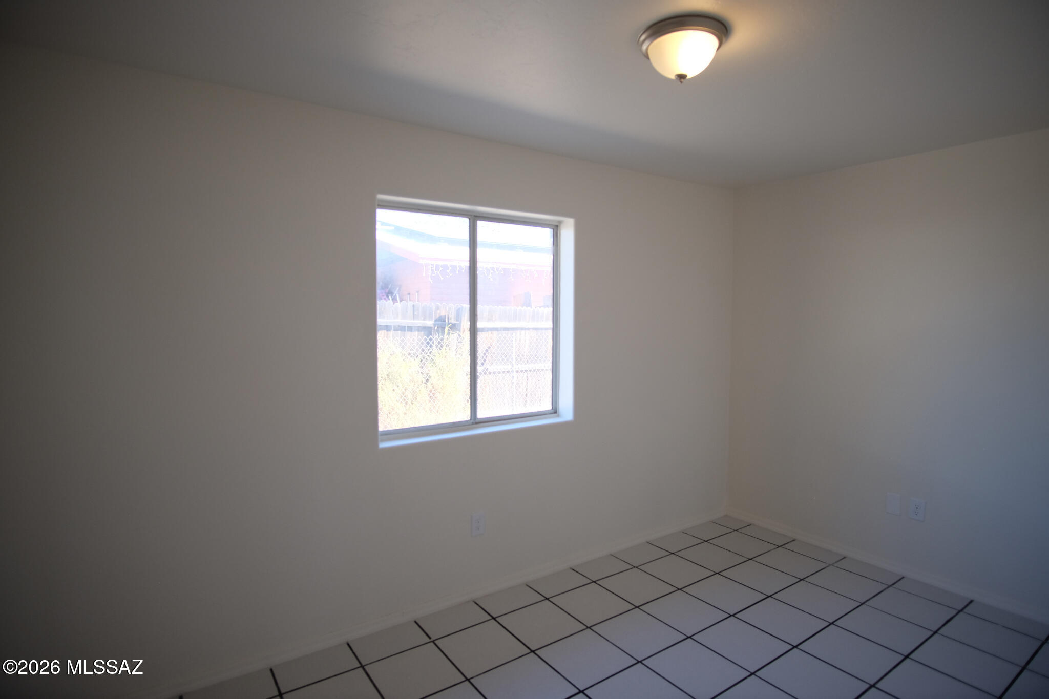 345 East Delta Road Tucson, AZ 85706 - Photo 37 of 45 an empty room with a window