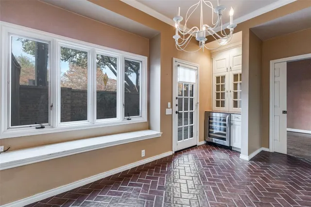 a bathroom with a sink a toilet a mirror and shower
