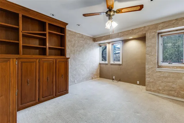 a view of a pathway with a wrought fence