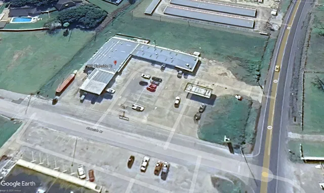 an aerial view of a house with outdoor space