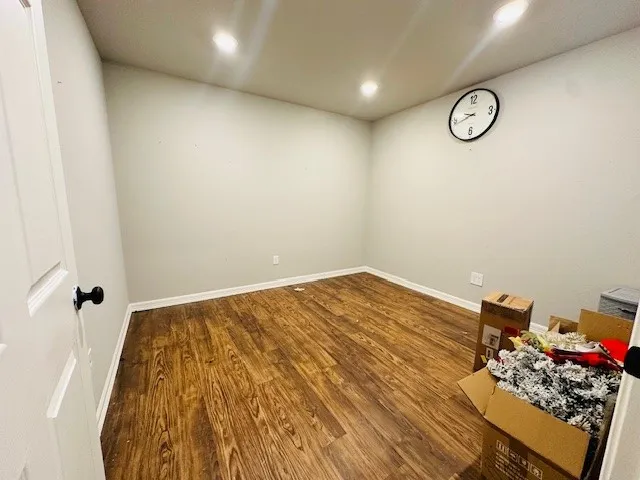 a view of a room with rack and wooden floor