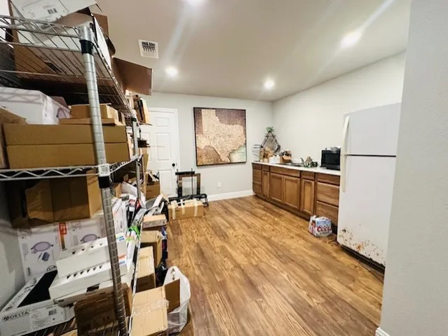 a kitchen with stainless steel appliances granite countertop a sink and cabinets