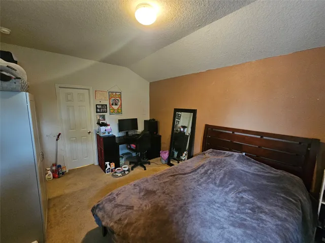 a bedroom with a bed and furniture