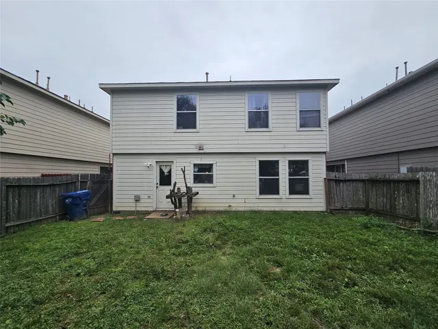 a house view with a sitting space and garden