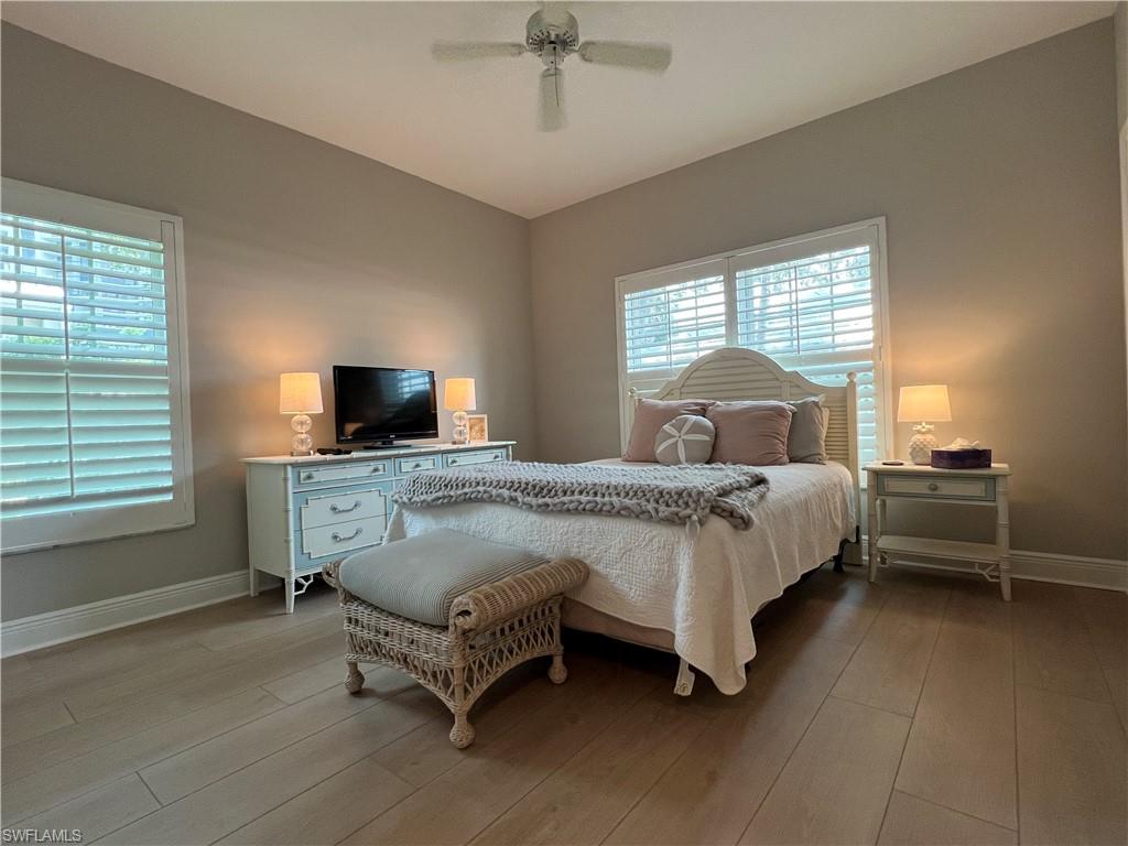5897 Chanteclair Drive, Unit 314A Naples, FL 34108 - Photo 14 of 21 a bed sitting in a bedroom next to a window