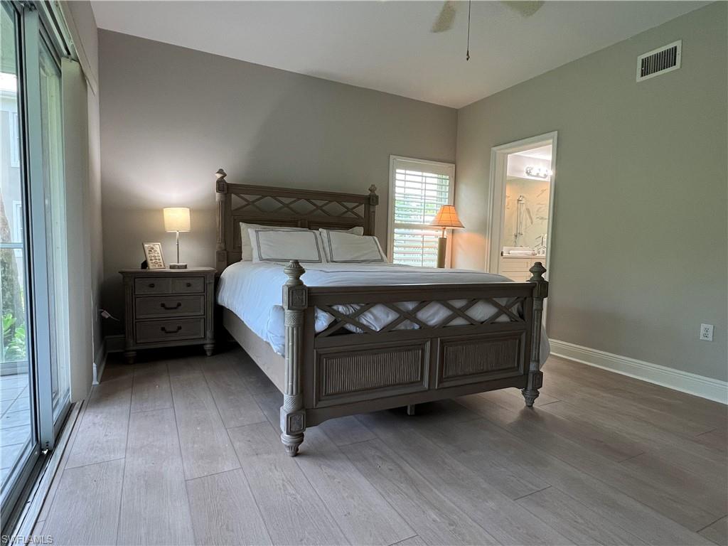 5897 Chanteclair Drive, Unit 314A Naples, FL 34108 - Photo 15 of 21 a bedroom with a bed a window and lamp