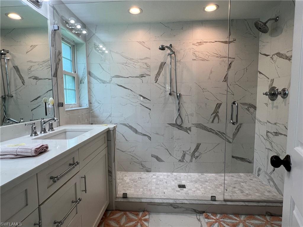 5897 Chanteclair Drive, Unit 314A Naples, FL 34108 - Photo 19 of 21 a bathroom with a sink and a mirror