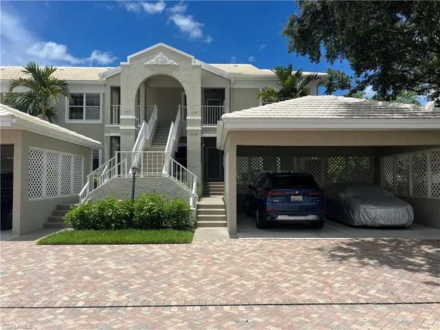 a view of a car parked in front of a house