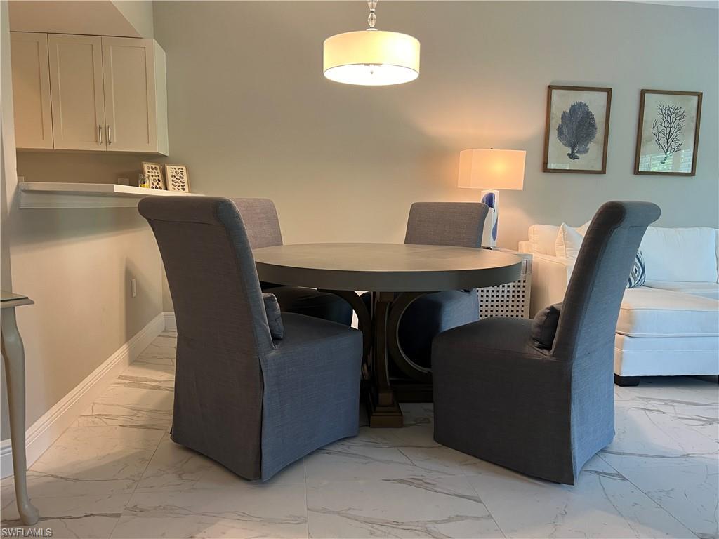 5897 Chanteclair Drive, Unit 314A Naples, FL 34108 - Photo 6 of 21 a view of a dining room with furniture