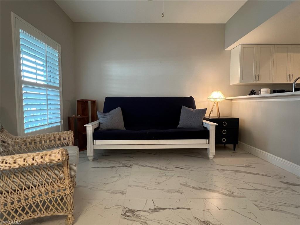 5897 Chanteclair Drive, Unit 314A Naples, FL 34108 - Photo 8 of 21 a living room with furniture and a window