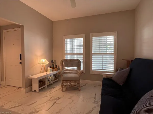 a living room with furniture and a window