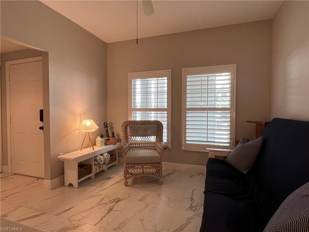 5897 Chanteclair Drive, Unit 314A Naples, FL 34108 - Photo 9 of 21 a living room with furniture and a window