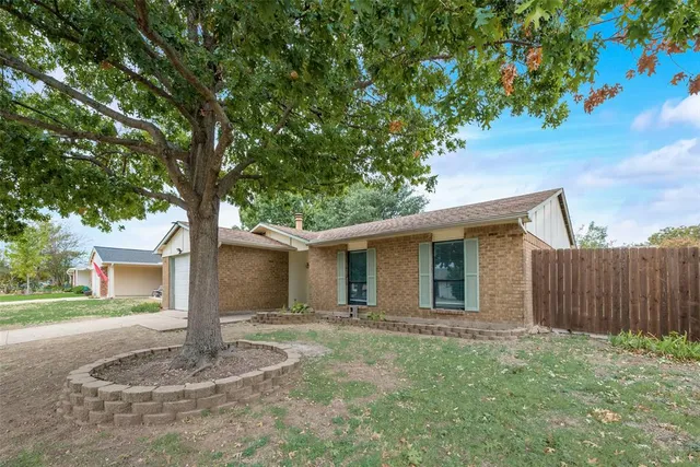 a house with trees in the background