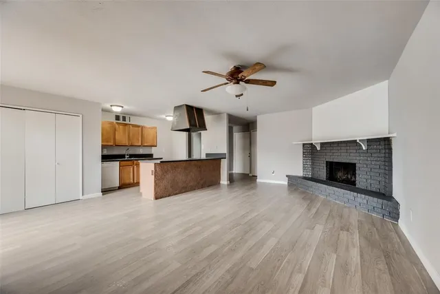 a view of kitchen with microwave and cabinets