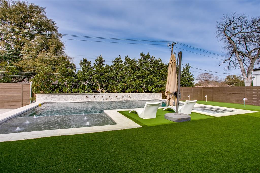 7141 Northaven Road Dallas, TX 75230 - Photo 36 of 38 a view of a swimming pool with a patio