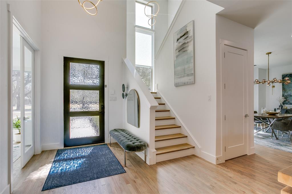 7141 Northaven Road Dallas, TX 75230 - Photo 7 of 38 a view of a hallway with windows and stairs