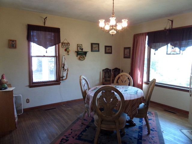 3338 North Union Road Polo, IL 61064 - Photo 8 of 24 a view of a dining room with furniture window and wooden floor