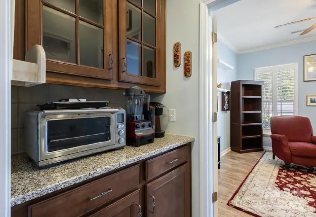 a kitchen with stainless steel appliances granite countertop a stove and a microwave