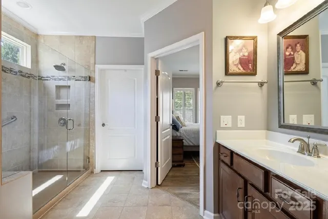 a spacious bathroom with a sink and a mirror