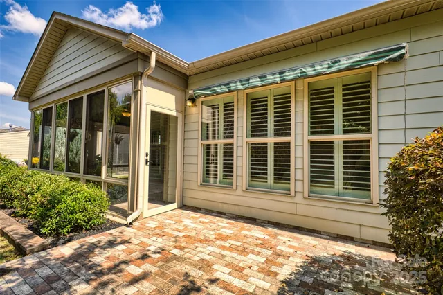 a front view of a house with a large windows
