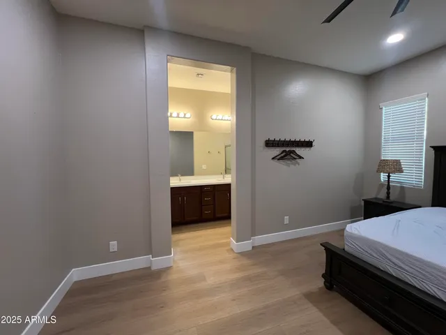 a bedroom with a bed and a view of bathroom