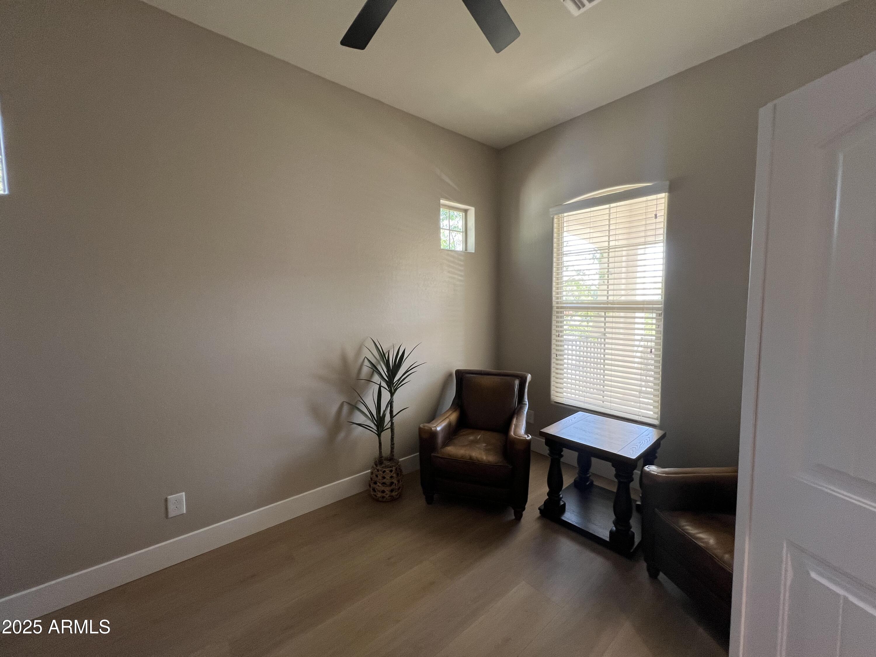 20480 West Point Ridge Road Buckeye, AZ 85396 - Photo 5 of 16 a view of a workspace with furniture and a window