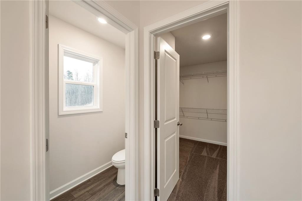 106 Windmill Court Calhoun, GA 30701 - Photo 18 of 29 a view of a bathroom from a hallway