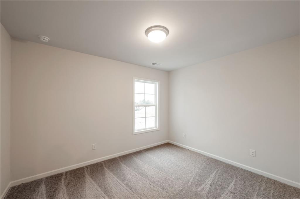 106 Windmill Court Calhoun, GA 30701 - Photo 19 of 29 an empty room with windows