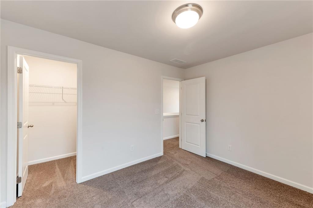 106 Windmill Court Calhoun, GA 30701 - Photo 20 of 29 an empty room with closet area