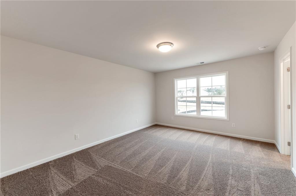 106 Windmill Court Calhoun, GA 30701 - Photo 22 of 29 an empty room with a window