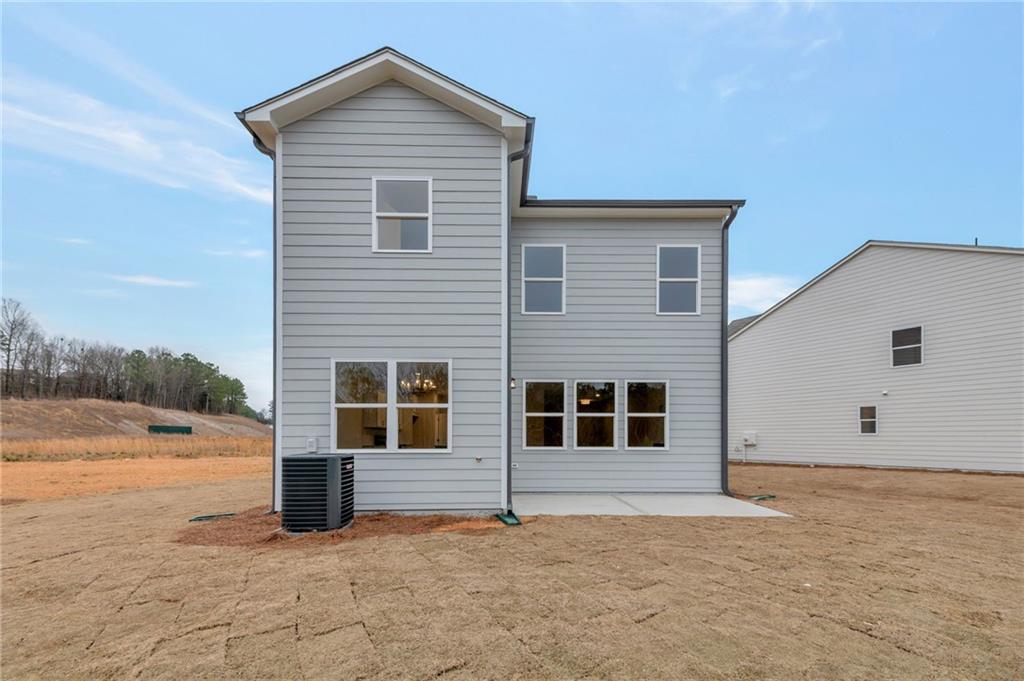 106 Windmill Court Calhoun, GA 30701 - Photo 24 of 29 a front view of a house with a yard