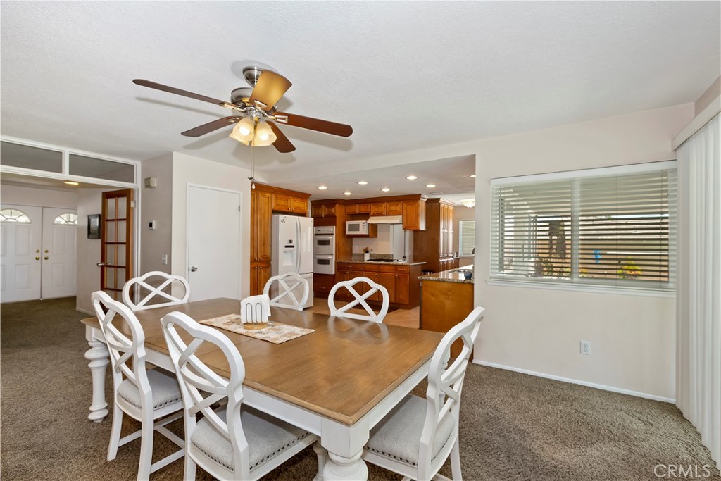 8527 Hillside Road Rancho Cucamonga, CA 91701 - Photo 11 of 50 a view of a dining room with furniture and window