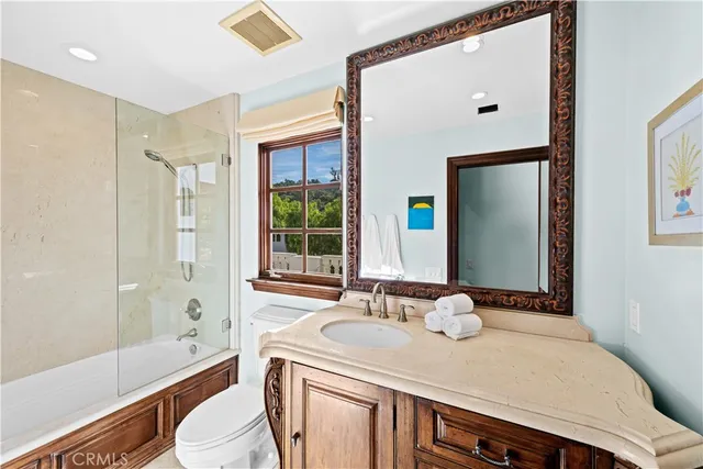 an aerial view of residential houses with outdoor space and swimming pool