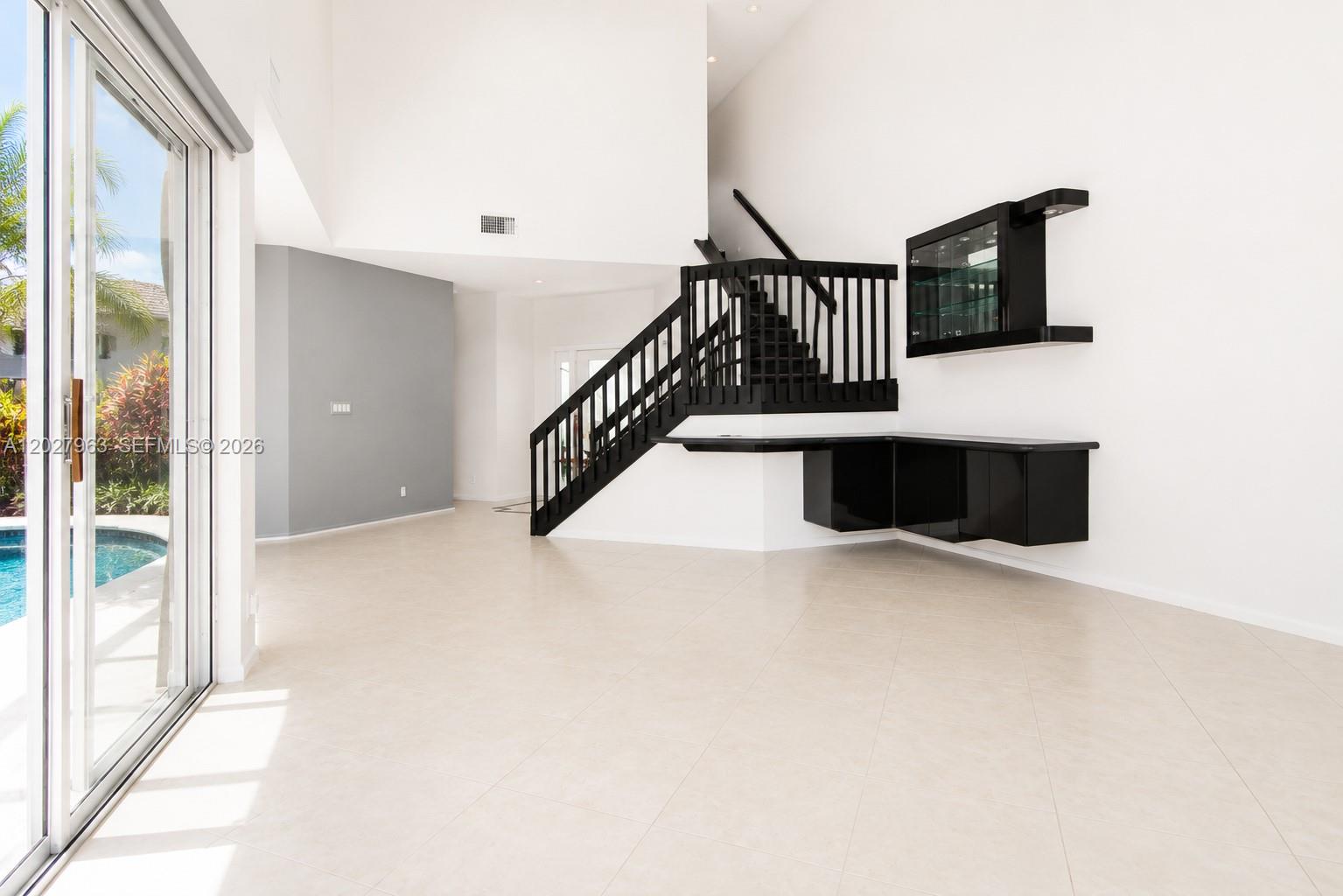 6646 Northwest 25th Terrace Boca Raton, FL 33496 - Photo 2 of 48 a view of entryway and hall with wooden floor
